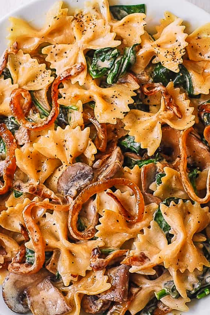 CREAMY BOW TIE PASTA WITH SPINACH MUSHROOMS, AND CARAMELIZED ONIONS ...